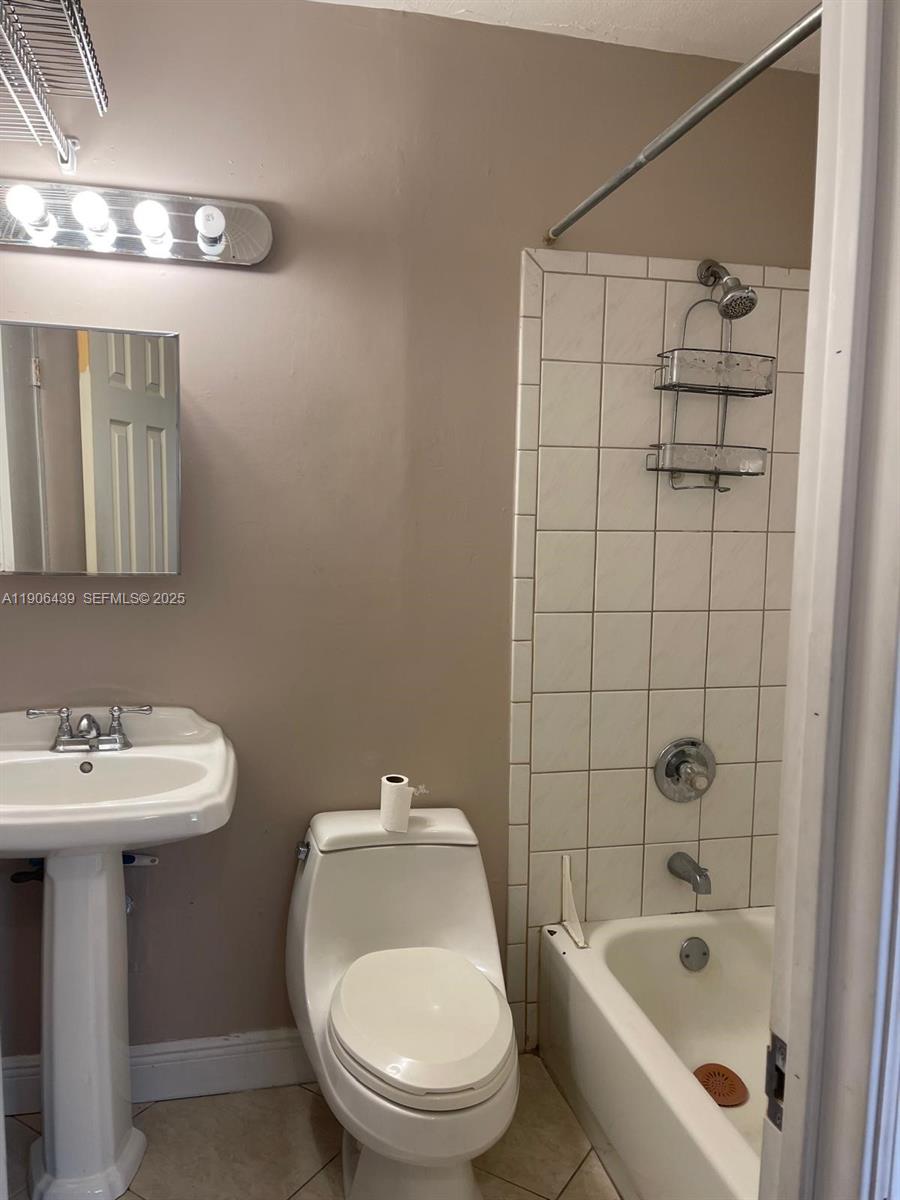 8635 Southwest 102nd Avenue Miami, FL 33173 - Photo 9 of 19 a bathroom with a sink a toilet and shower