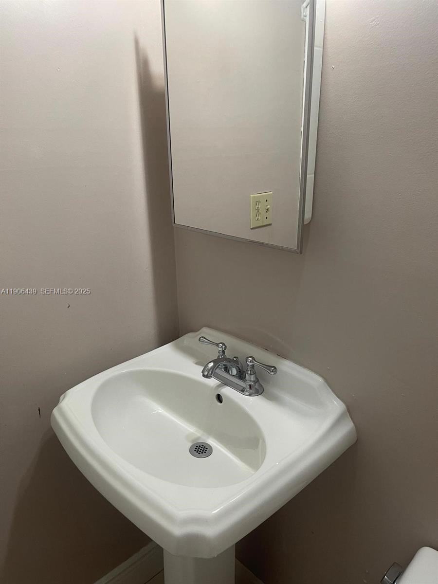 8635 Southwest 102nd Avenue Miami, FL 33173 - Photo 10 of 19 a bathroom with a sink and a vanity