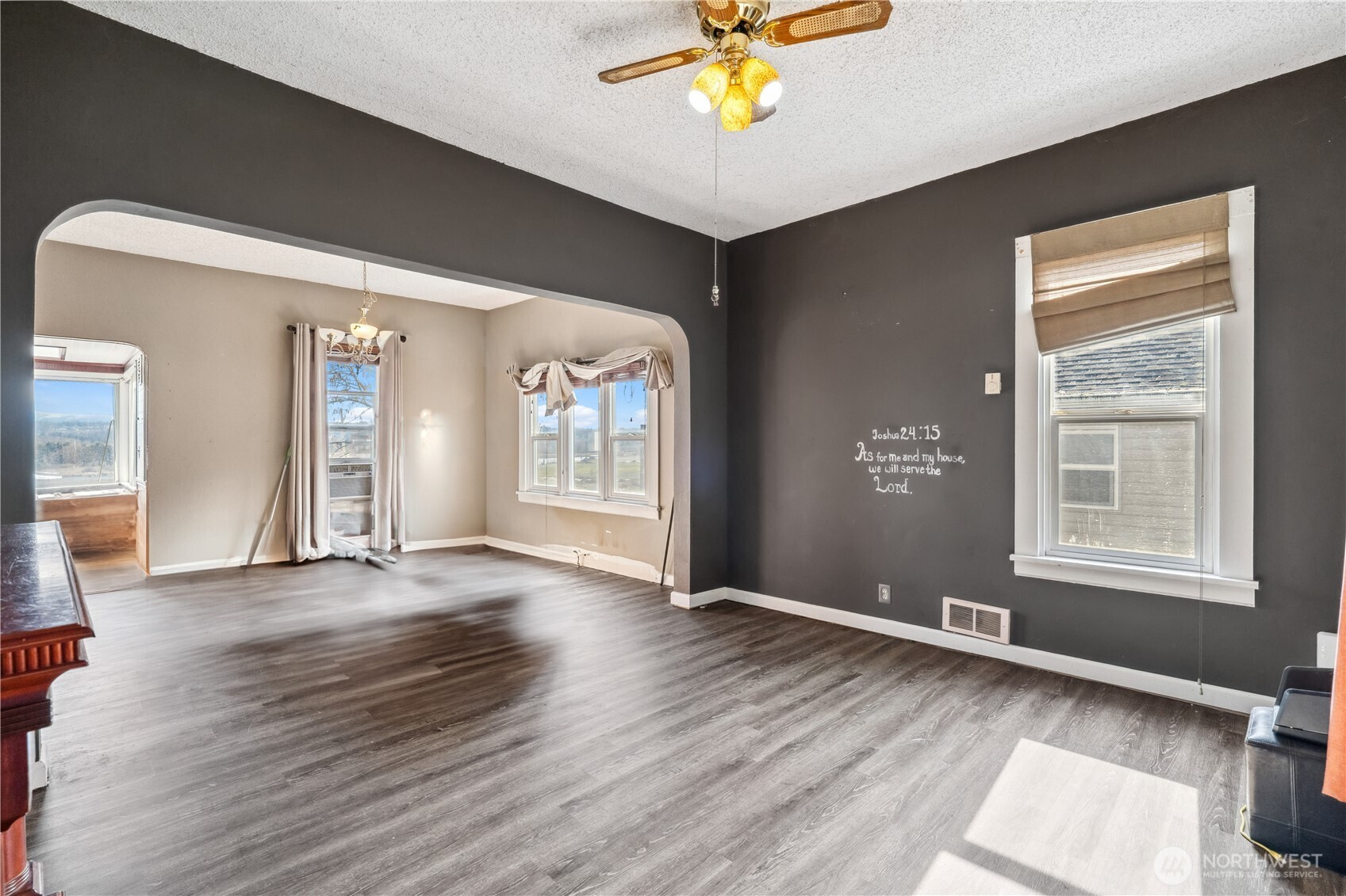 2113 East Grand Avenue Everett, WA 98201 - Photo 4 of 22 an empty room with wooden floor and a window