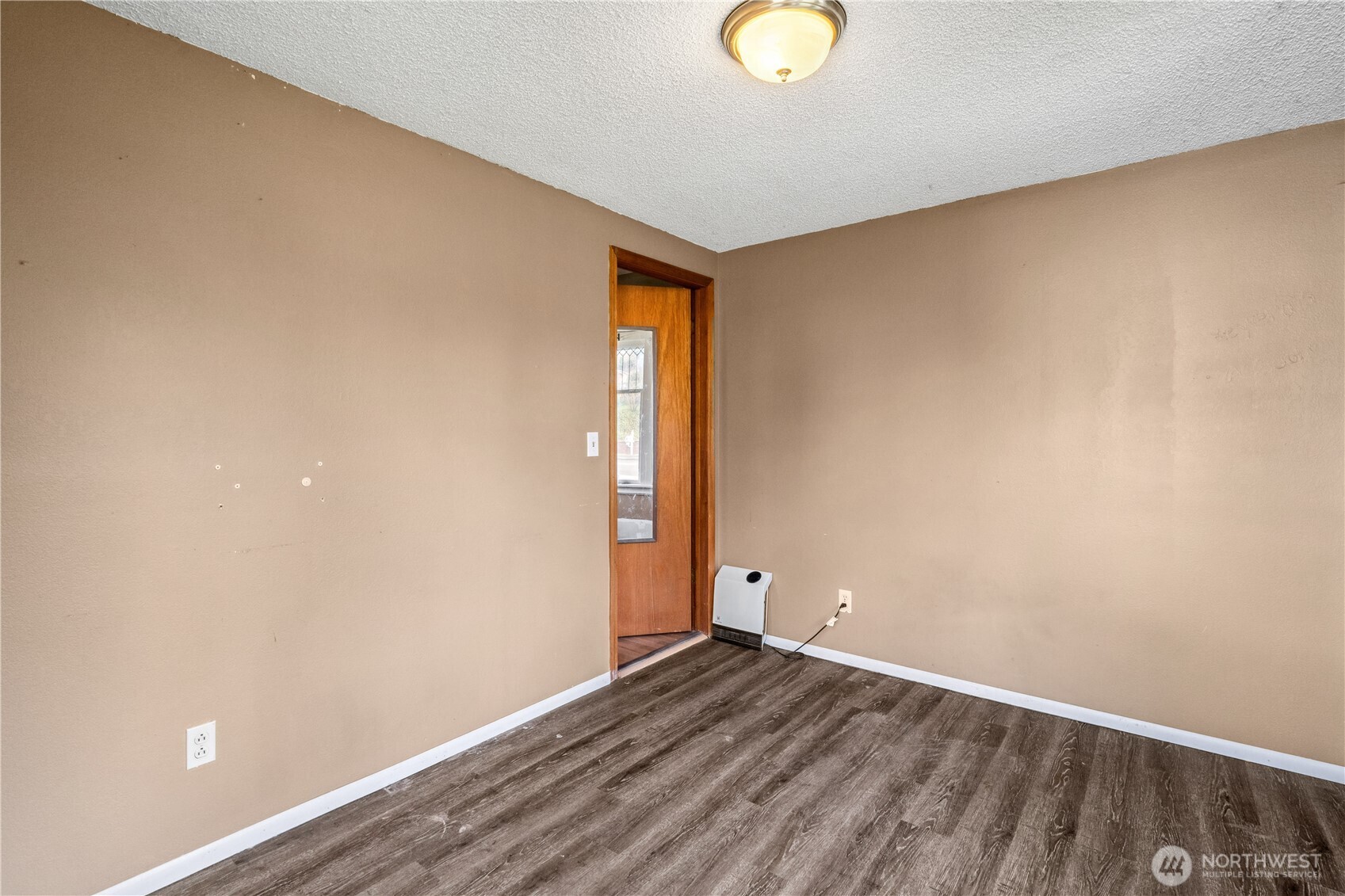 2113 East Grand Avenue Everett, WA 98201 - Photo 9 of 22 a view of empty room with wooden floor