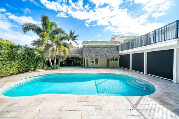 an aerial view of residential houses with swimming pool