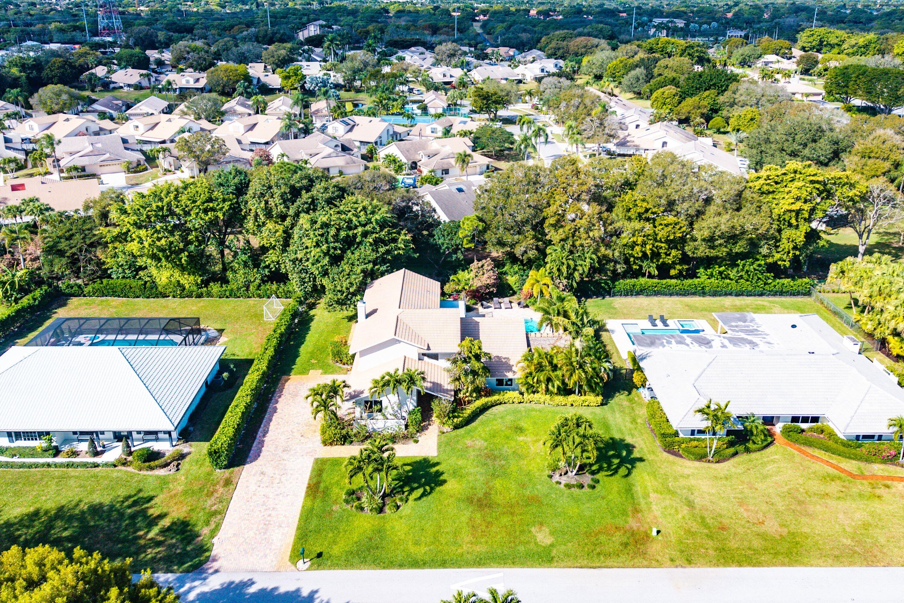 10893 Gleneagles Road Boynton Beach, FL 33436 - Photo 27 of 134 an aerial view of residential houses with outdoor space and swimming pool