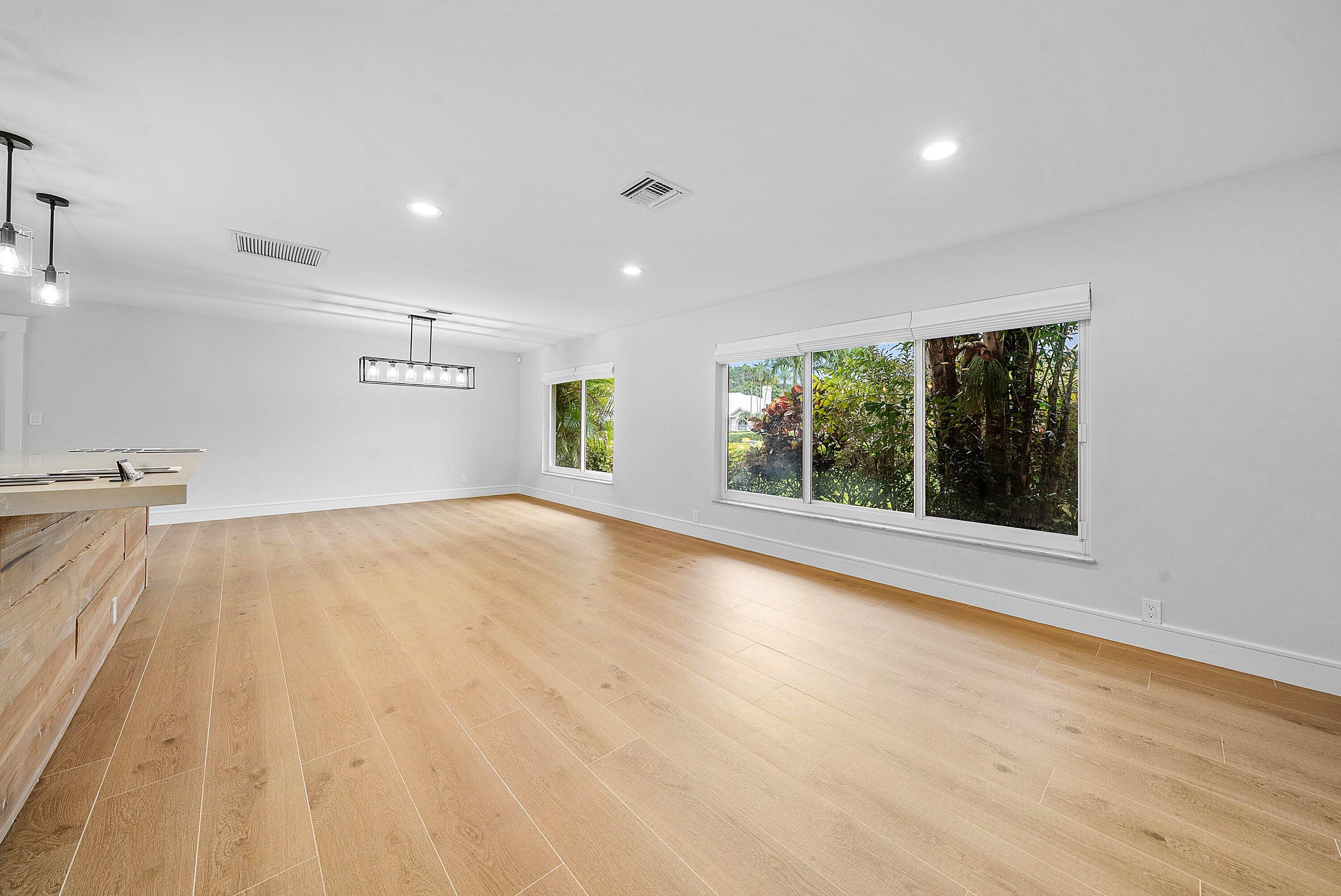 10893 Gleneagles Road Boynton Beach, FL 33436 - Photo 35 of 134 a view of an empty room with a window and wooden floor