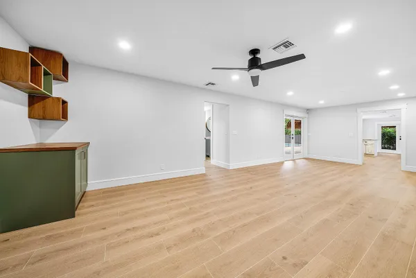 a view of house with garden space and trees