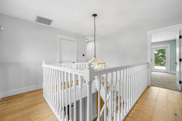 a view of a house with a swimming pool and a yard