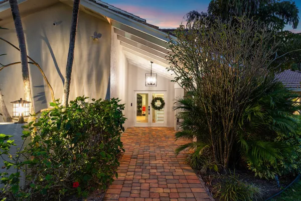 a large bathroom with a large mirror vanity and shower