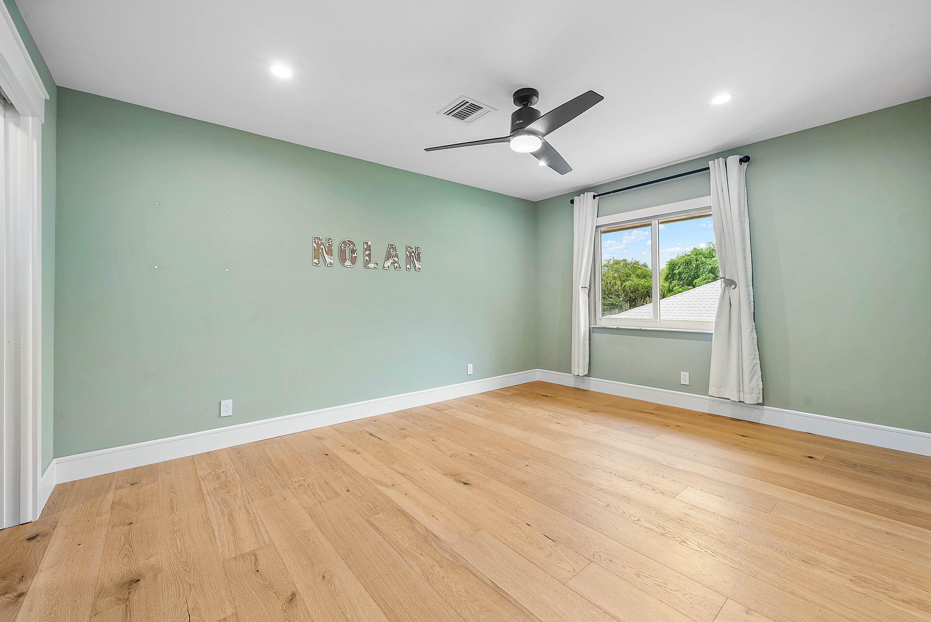10893 Gleneagles Road Boynton Beach, FL 33436 - Photo 51 of 134 an empty room with a ceiling fan and window