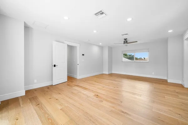 an aerial view of residential house with outdoor space and trees around