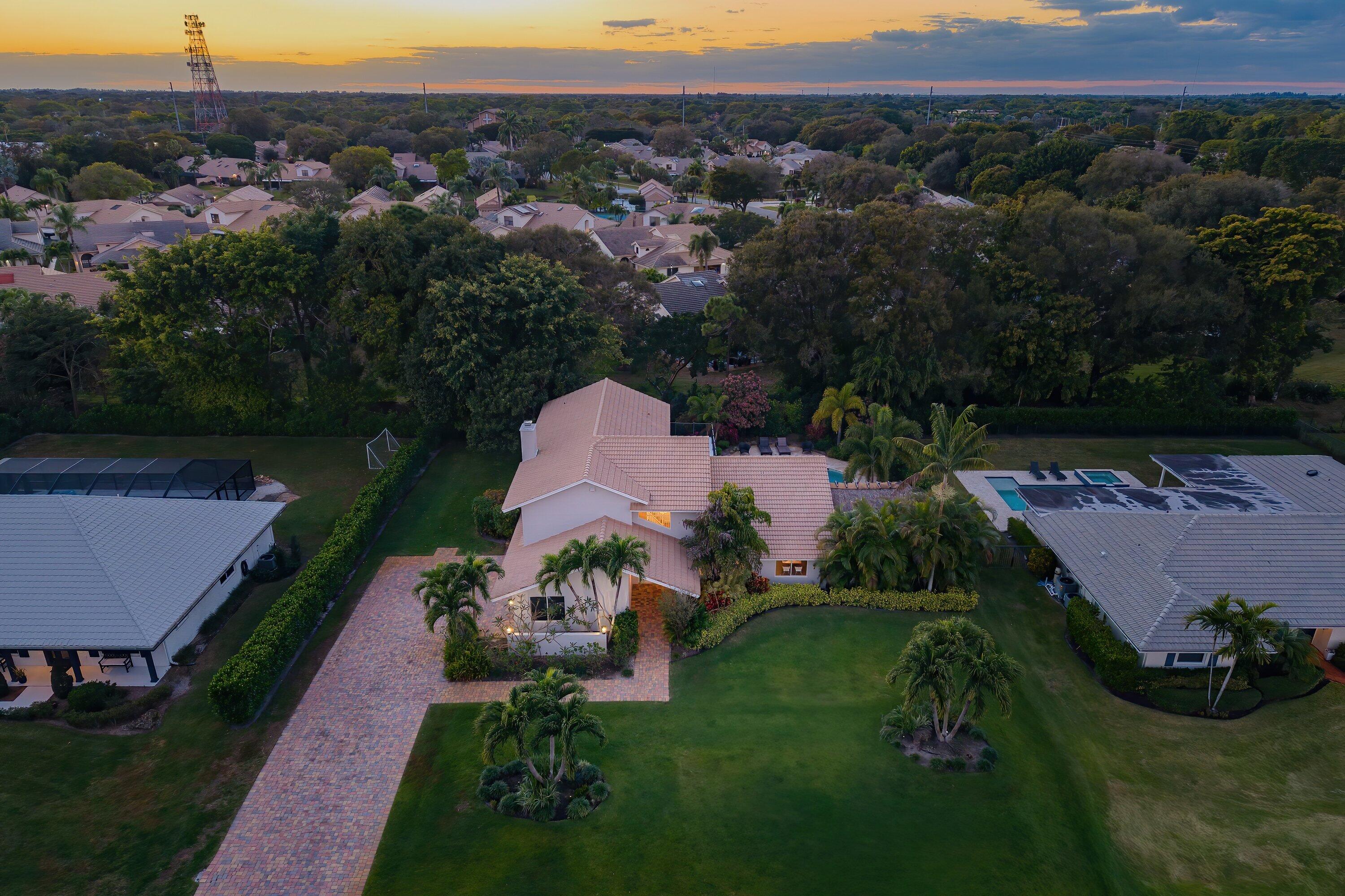 10893 Gleneagles Road Boynton Beach, FL 33436 - Photo 82 of 134 a aerial view of a house with garden space and street view