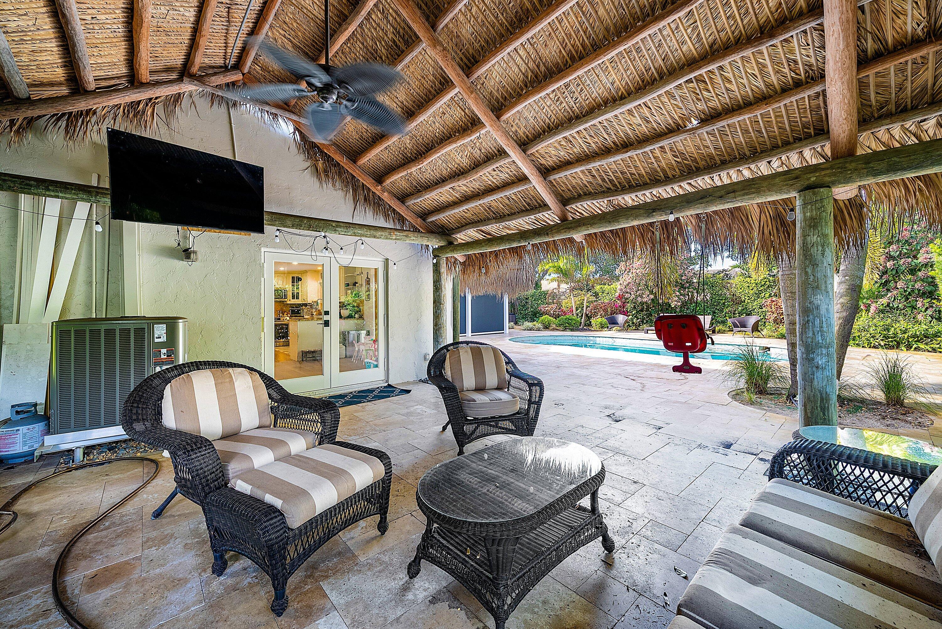 10893 Gleneagles Road Boynton Beach, FL 33436 - Photo 97 of 134 a living room with furniture and a floor to ceiling window