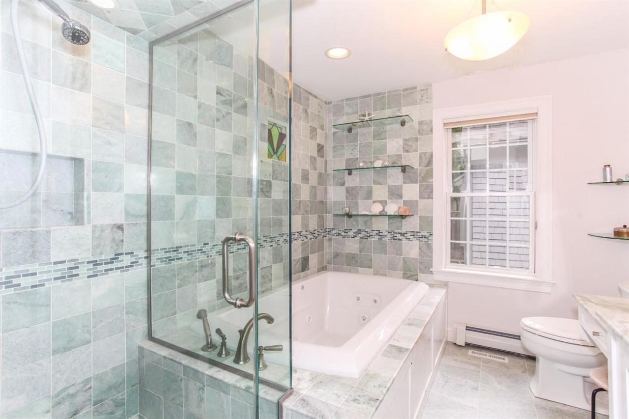 693 Great Neck Road South Mashpee, MA 02649 - Photo 18 of 23 a bathroom with a granite countertop bathtub shower and toilet