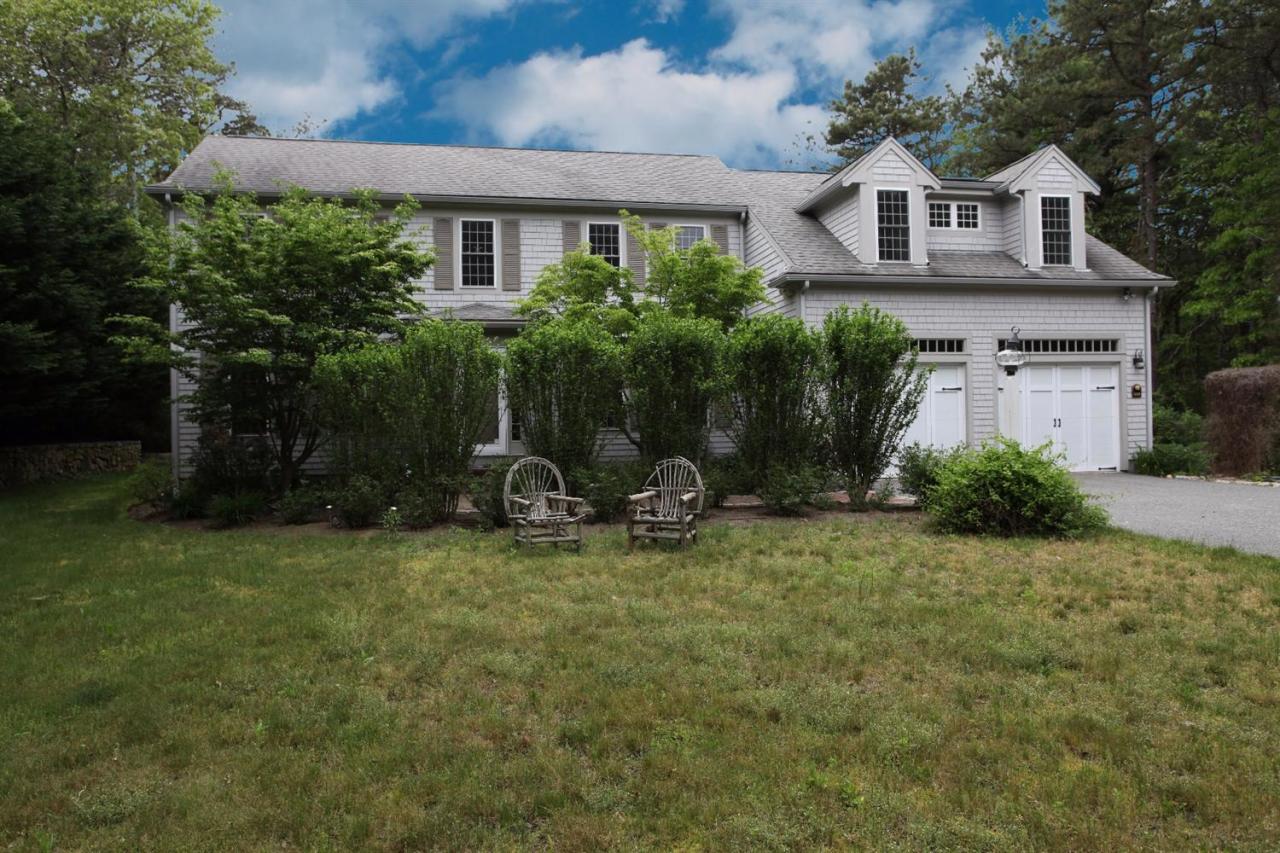 693 Great Neck Road South Mashpee, MA 02649 - Photo 4 of 23 a view of a house with backyard and garden