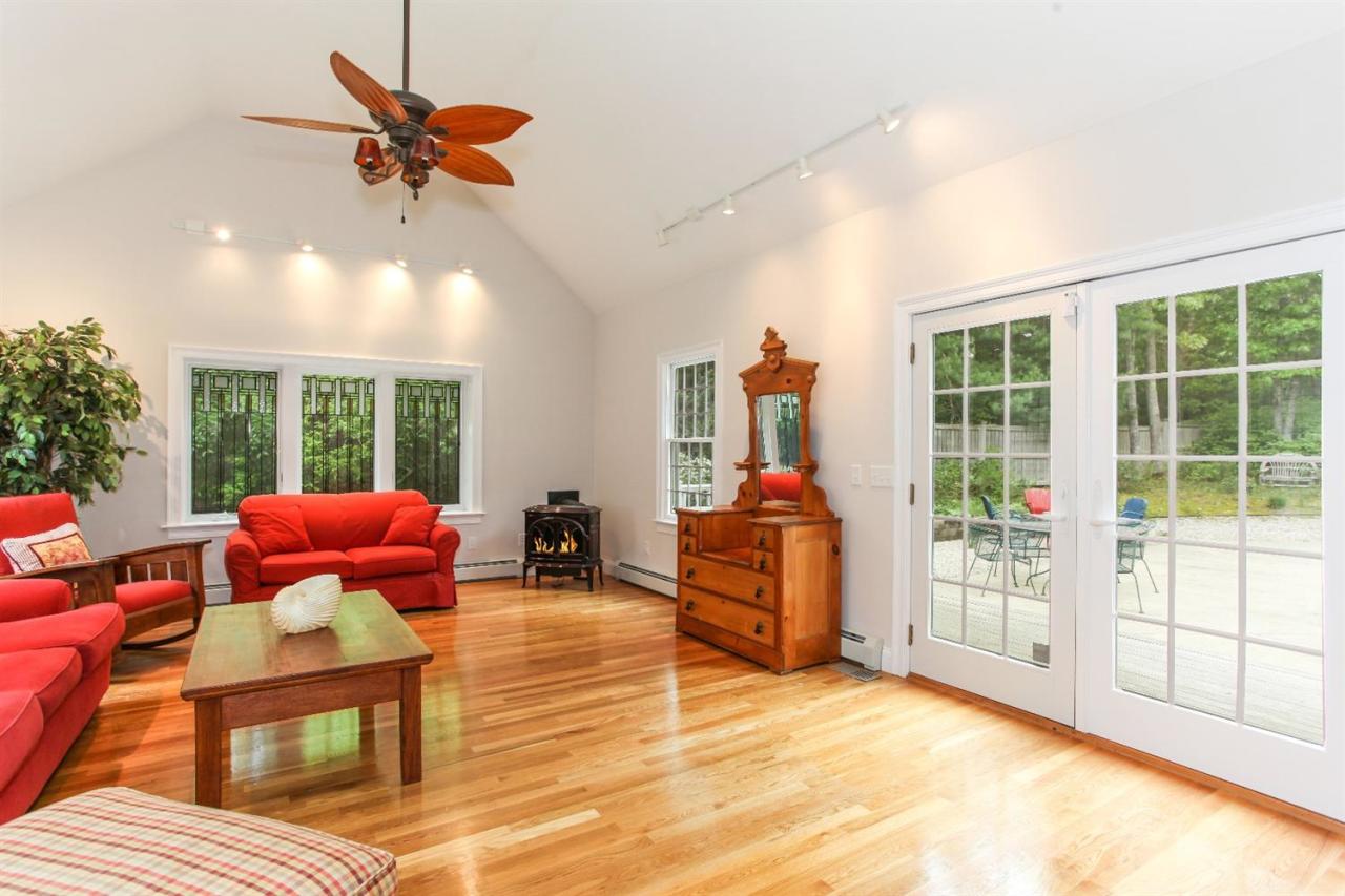 693 Great Neck Road South Mashpee, MA 02649 - Photo 10 of 23 a bedroom with furniture and a large window