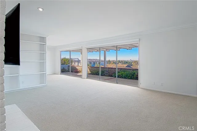 a view of a room with furniture and a fireplace