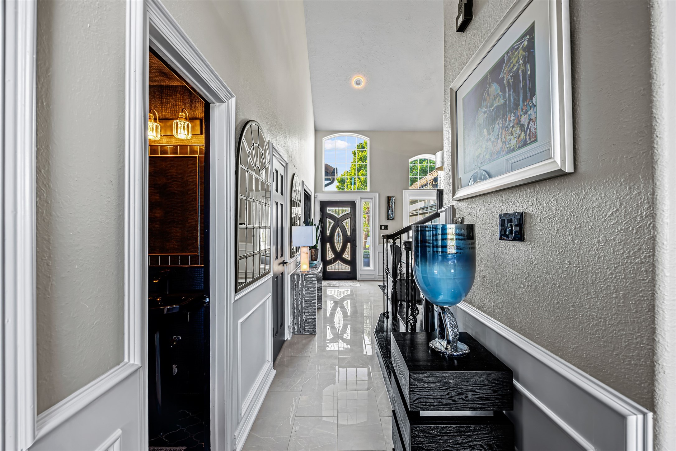 12345 White Oak Point Conroe, TX 77304 - Photo 12 of 50 a hallway with painting on the wall and a window