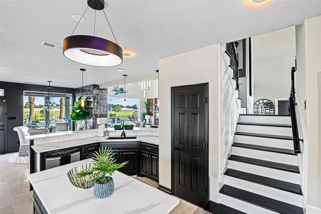 a kitchen with a table and chairs
