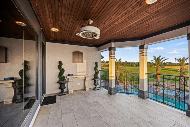 a kitchen with a stove and a wooden floor