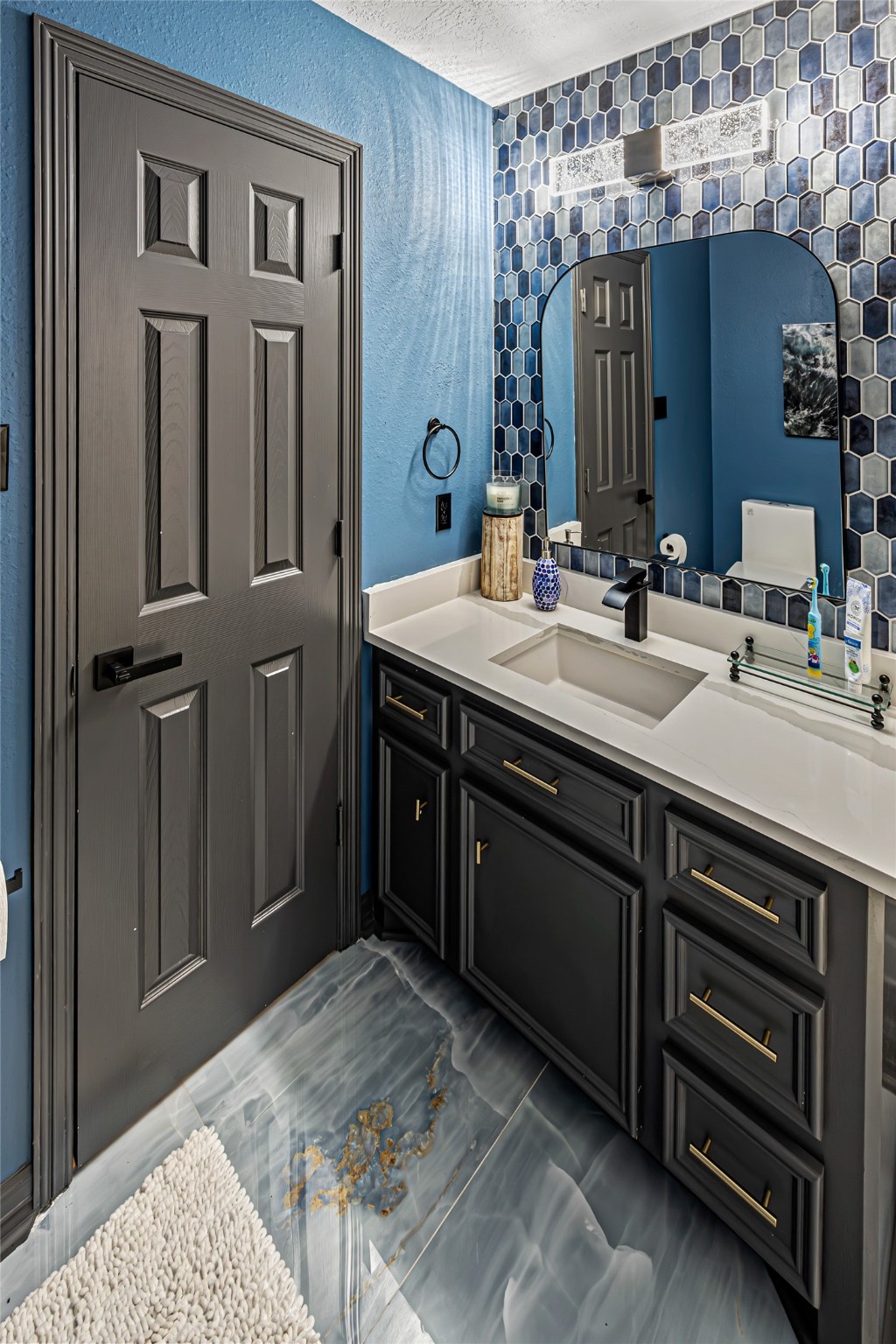 12345 White Oak Point Conroe, TX 77304 - Photo 36 of 50 a spacious bathroom with a granite countertop sink and a mirror