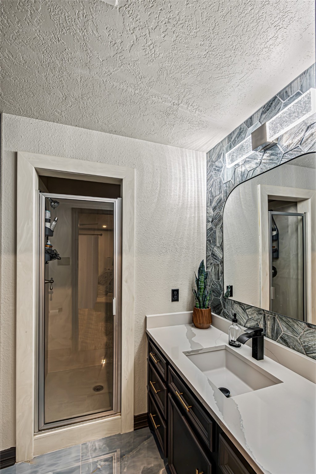 12345 White Oak Point Conroe, TX 77304 - Photo 37 of 50 a bathroom with a sink and a mirror