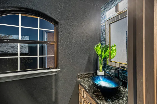 a view of a swimming pool with furniture