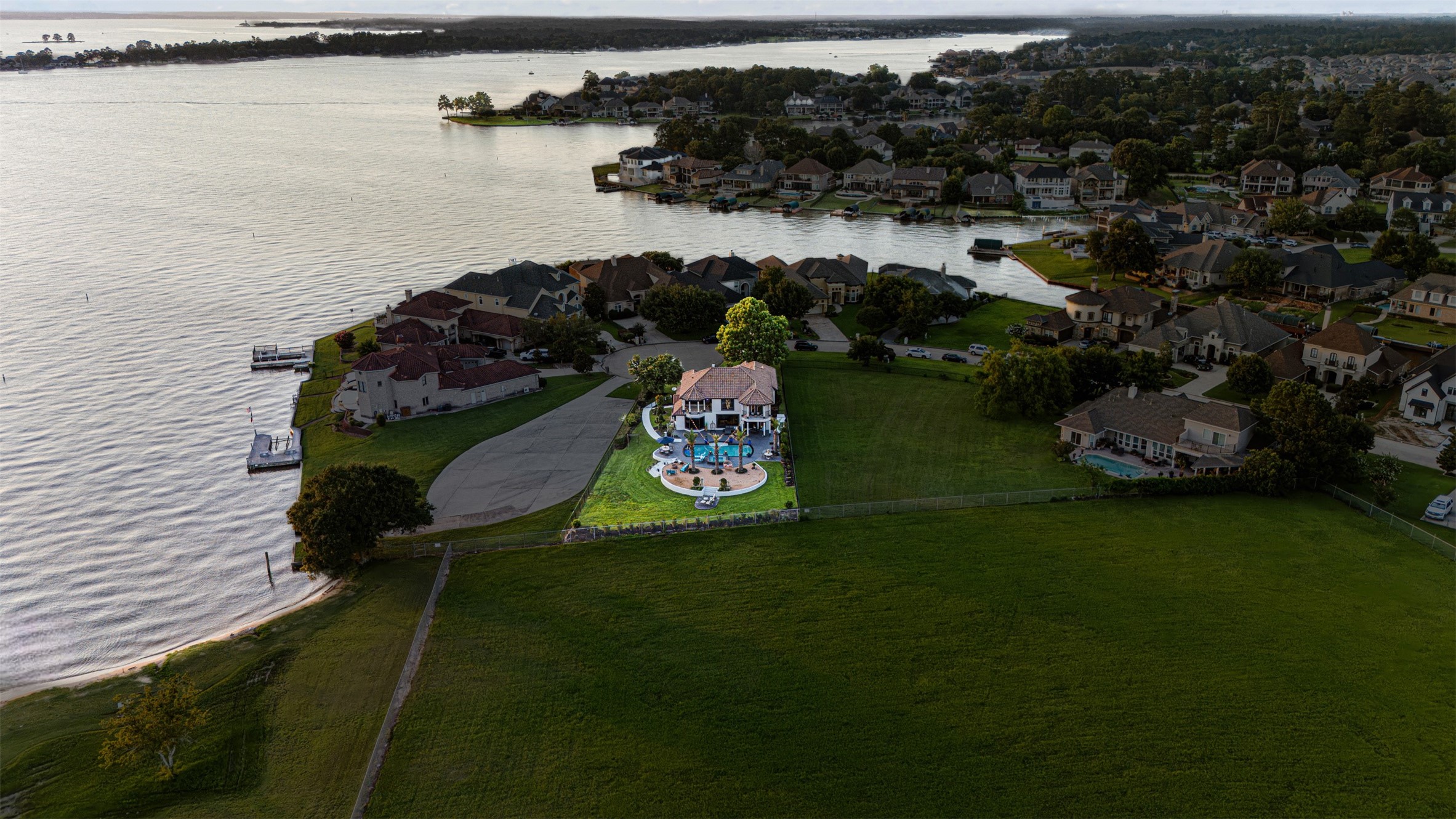 12345 White Oak Point Conroe, TX 77304 - Photo 44 of 50 a aerial view of a house with garden space and lake view