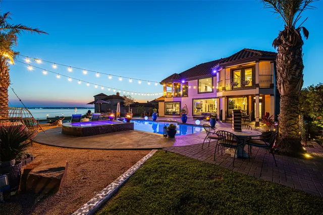 a outdoor space with lots of furniture and swimming pool