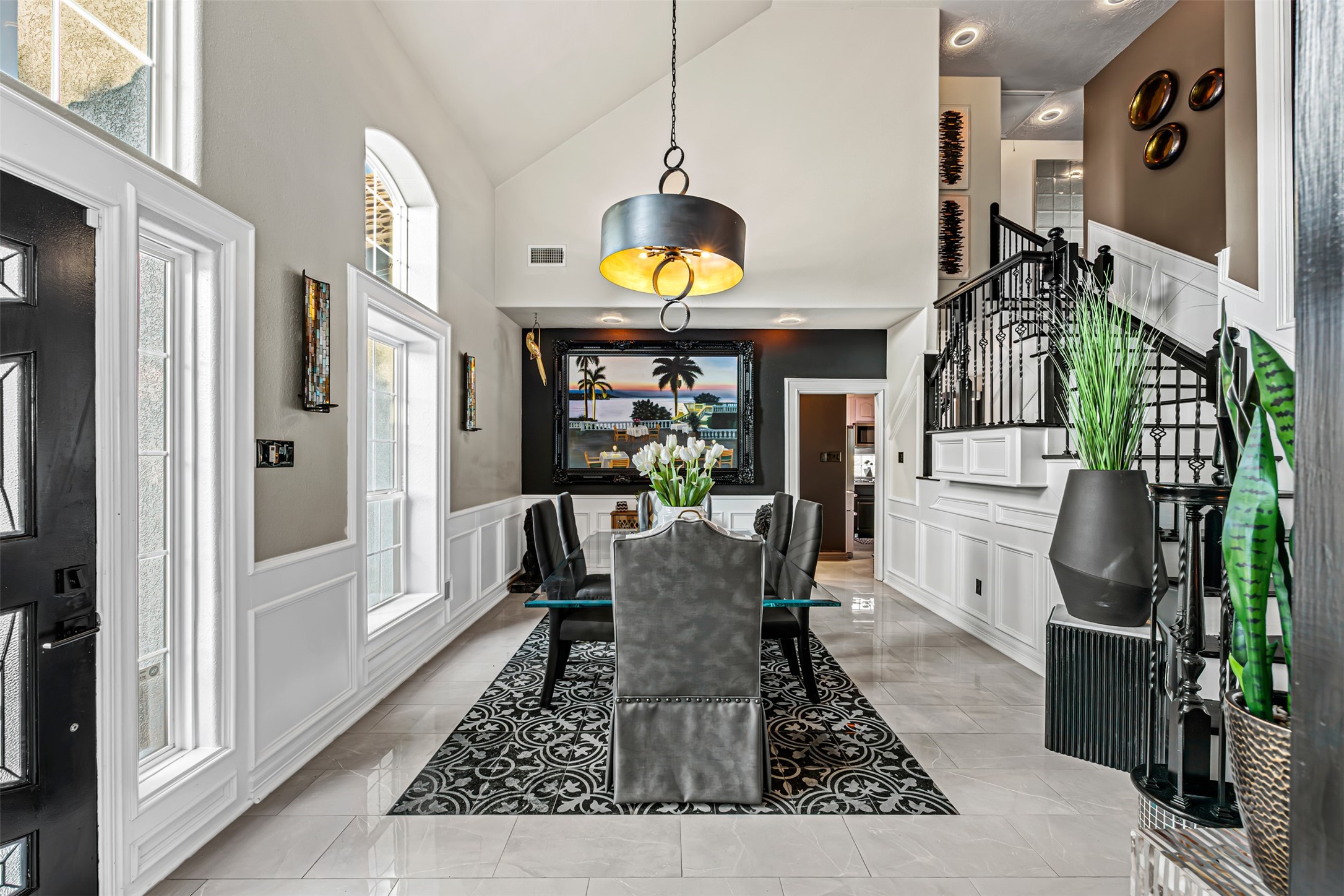 12345 White Oak Point Conroe, TX 77304 - Photo 7 of 50 a dining room with furniture a rug a potted plant and wooden floor