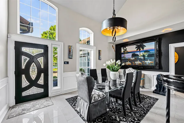 a dining room with furniture and window