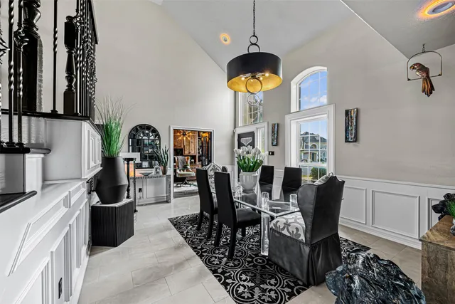 a view of a dining room with furniture and a kitchen