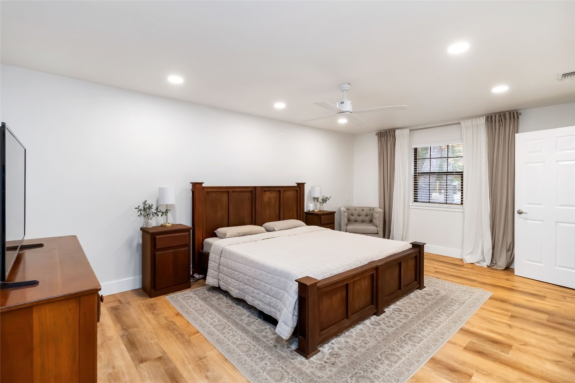 326 Pine View Loop Bastrop, TX 78602 - Photo 12 of 29 Bedroom featuring light wood-style floors, ceiling fan, and recessed lighting
