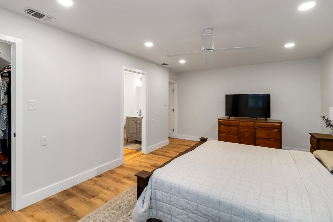 326 Pine View Loop Bastrop, TX 78602 - Photo 13 of 29 Bedroom featuring recessed lighting, light wood-type flooring, ceiling fan, and a spacious closet