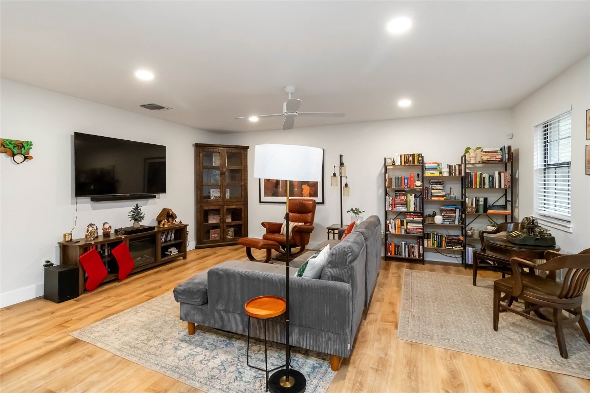 326 Pine View Loop Bastrop, TX 78602 - Photo 7 of 29 Living room featuring a ceiling fan, light wood-style flooring, and recessed lighting