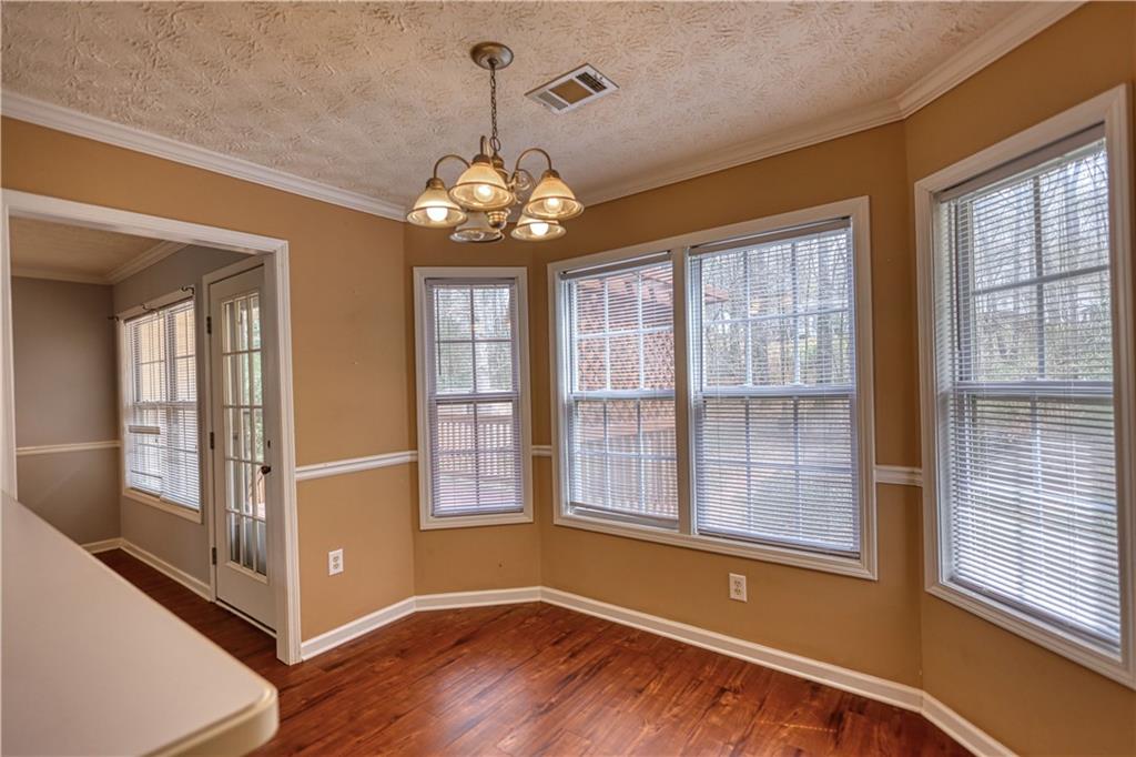 1006 English Oak Lane Winder, GA 30680 - Photo 18 of 83 a view of a livingroom with a ceiling fan and window