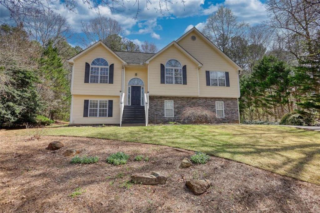 1006 English Oak Lane Winder, GA 30680 - Photo 2 of 83 a front view of a house with a yard and garage