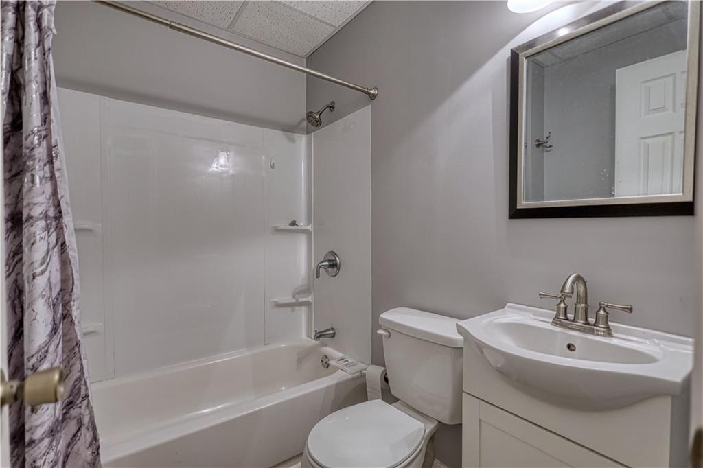 1006 English Oak Lane Winder, GA 30680 - Photo 50 of 83 a bathroom with a sink toilet and shower