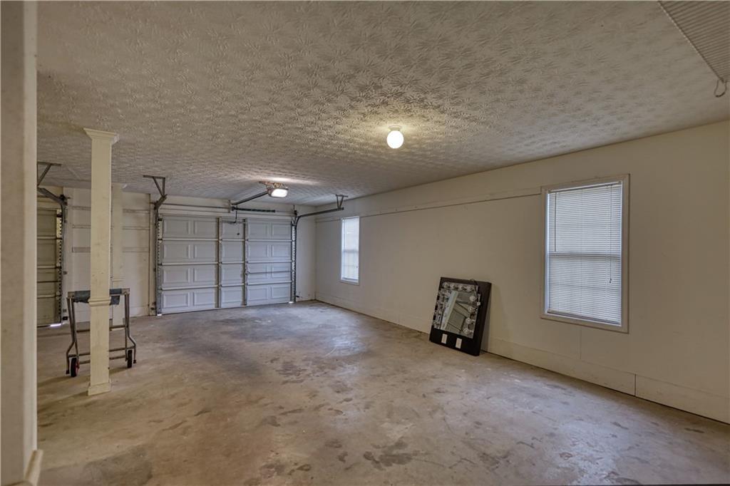 1006 English Oak Lane Winder, GA 30680 - Photo 58 of 83 an empty room with windows and closet