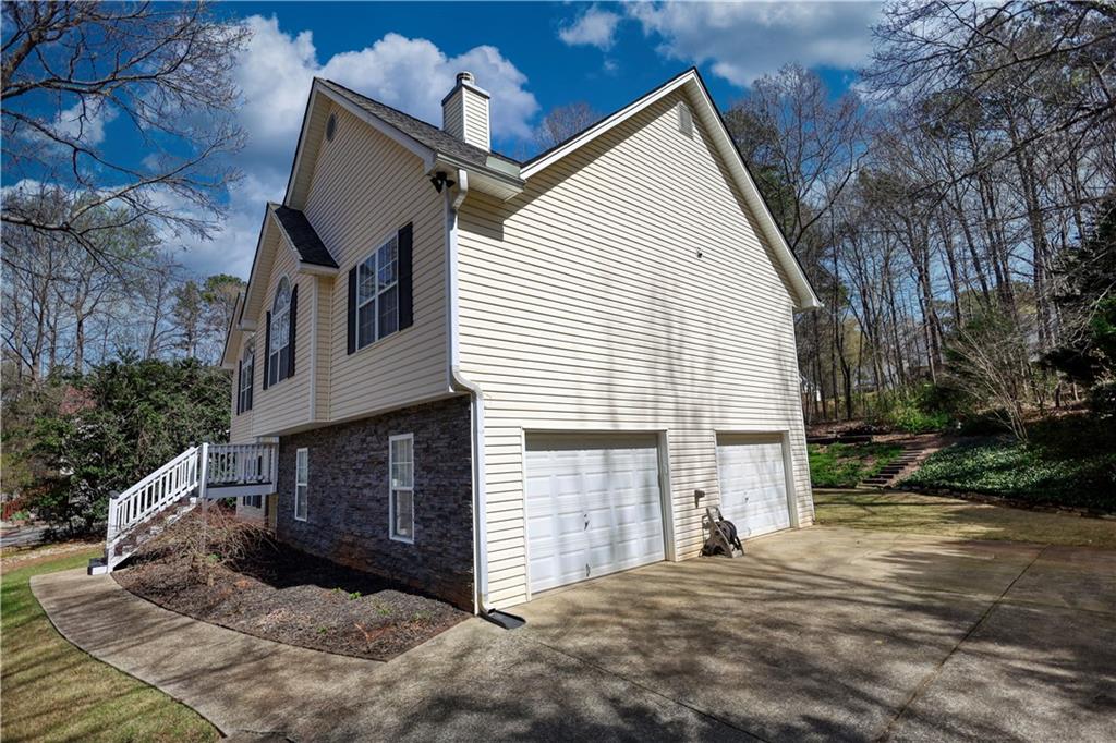 1006 English Oak Lane Winder, GA 30680 - Photo 62 of 83 a view of a house with a yard