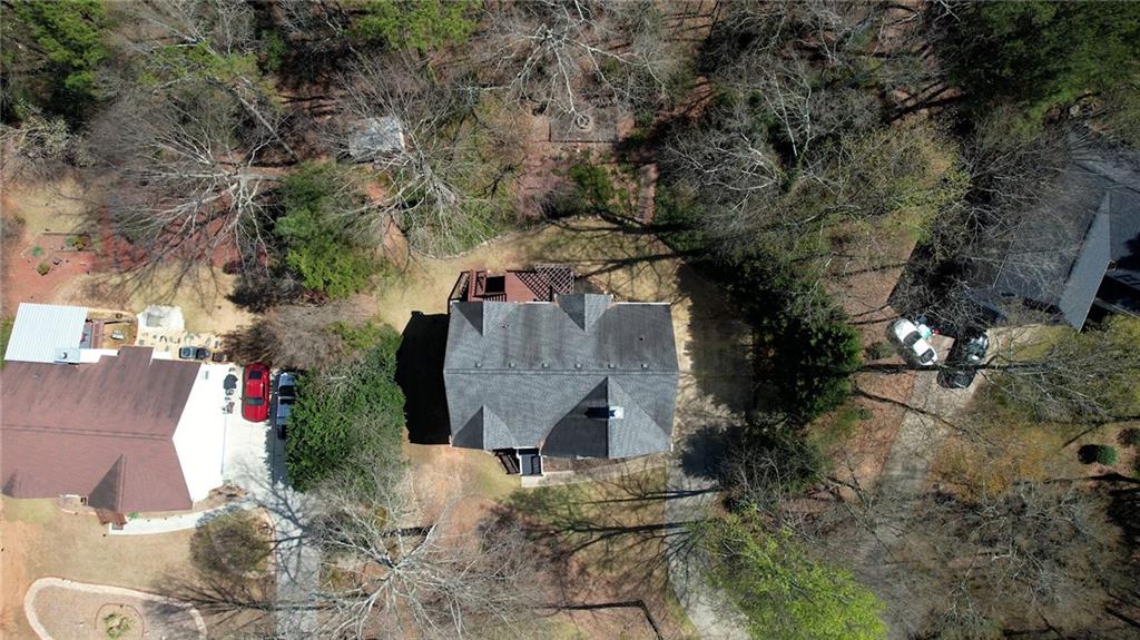 1006 English Oak Lane Winder, GA 30680 - Photo 75 of 83 an aerial view of a house with a yard and large tree