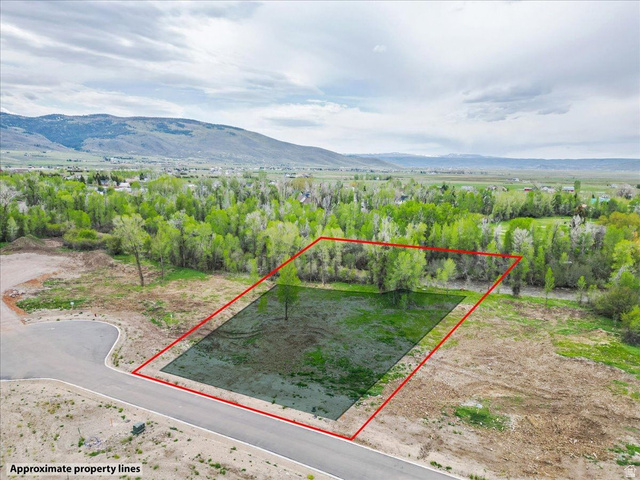 829 River Haven Road, Unit 111 Oakley, UT 84055 - Photo 4 of 12 Cleared lot with a paved street frontage, surrounded by mature trees
