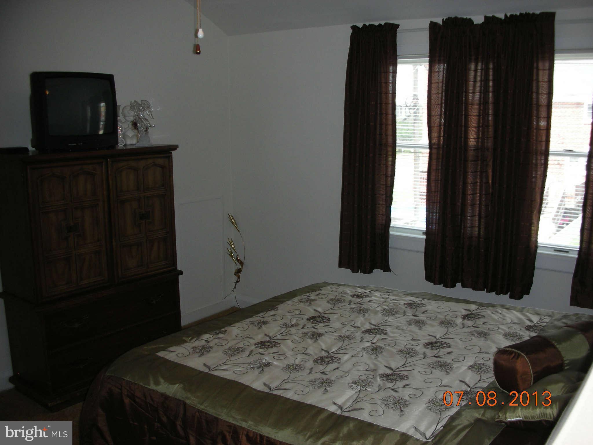 1930 Barry Road Baltimore, MD 21222 - Photo 14 of 30 a bedroom with a bed and a window