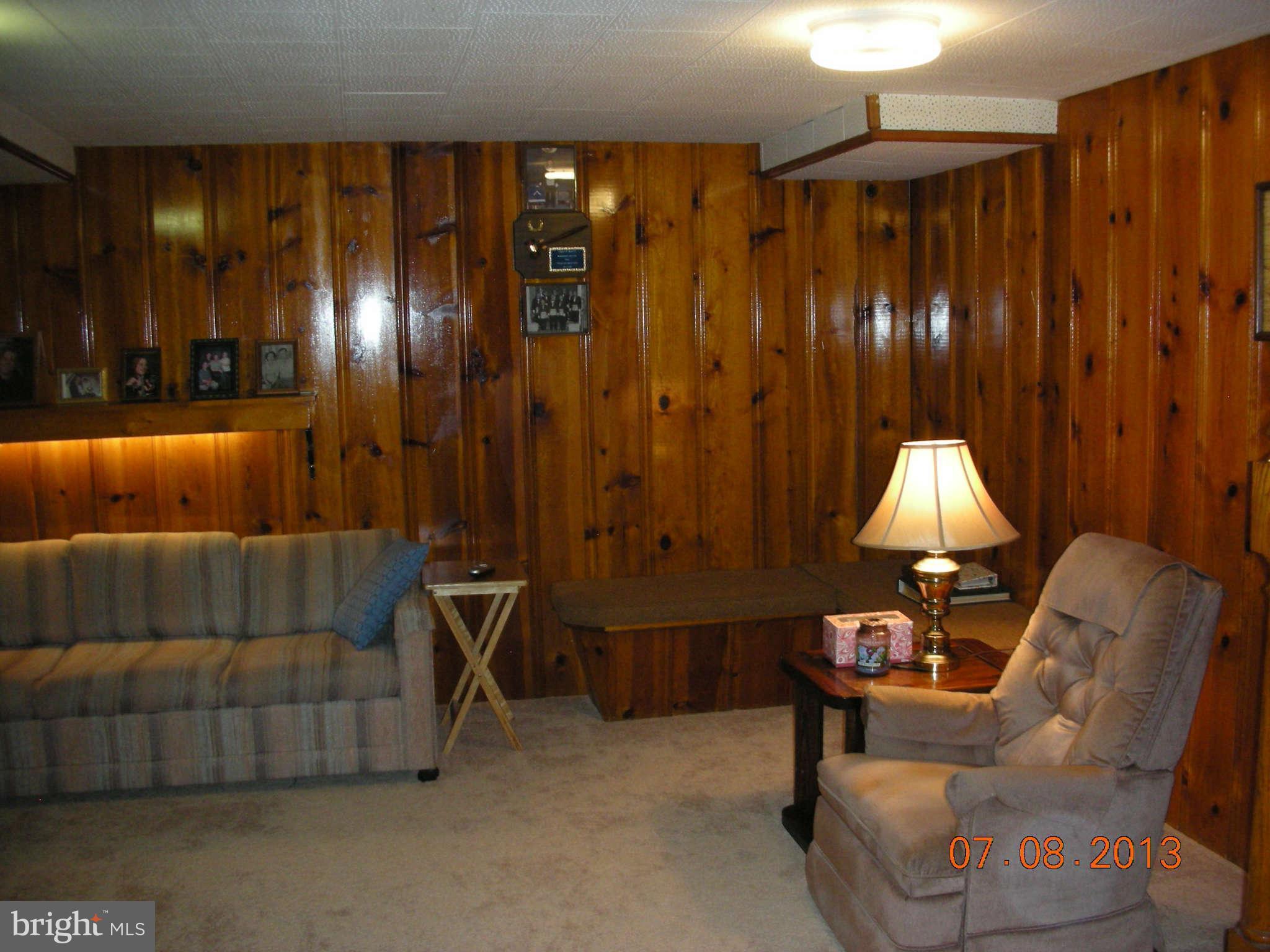 1930 Barry Road Baltimore, MD 21222 - Photo 22 of 30 a room with furniture and a lamp