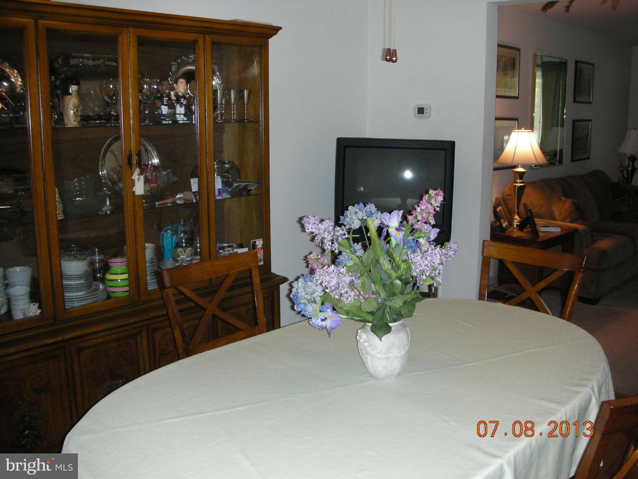 1930 Barry Road Baltimore, MD 21222 - Photo 8 of 30 a bedroom with a bed table flowerpot and window