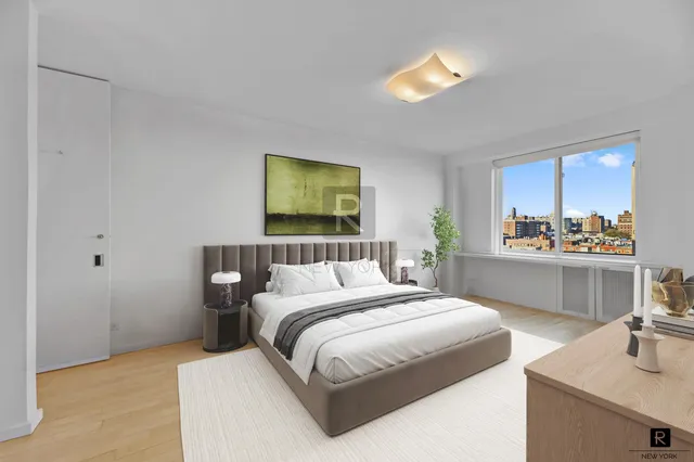 a bedroom with a bed and a night stand