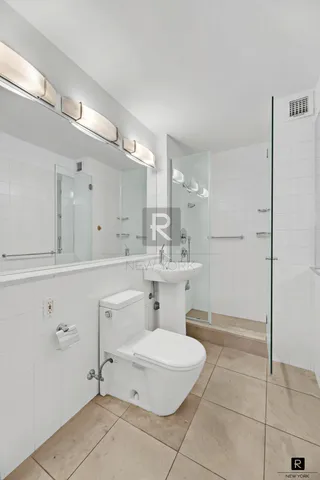 a view of kitchen with microwave and cabinets