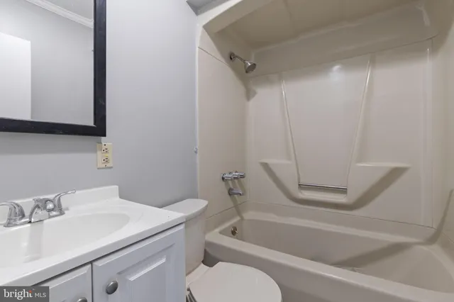 a bathroom with a sink toilet and bathtub