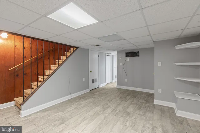 a view of an empty room with stairs