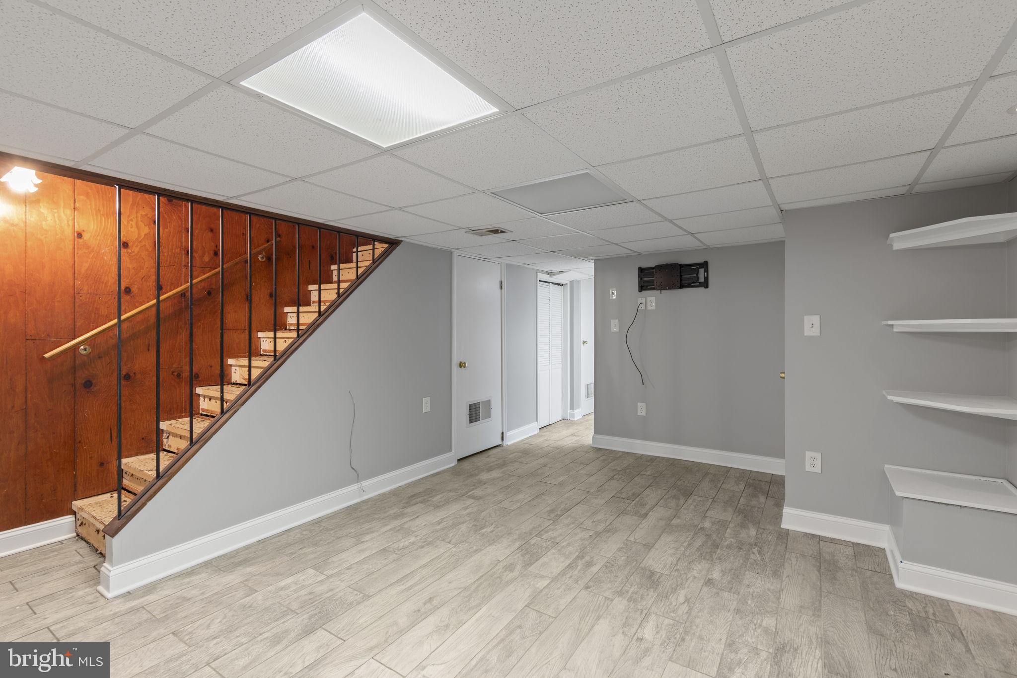 7731 Eastdale Road Baltimore, MD 21224 - Photo 17 of 26 a view of an empty room with stairs