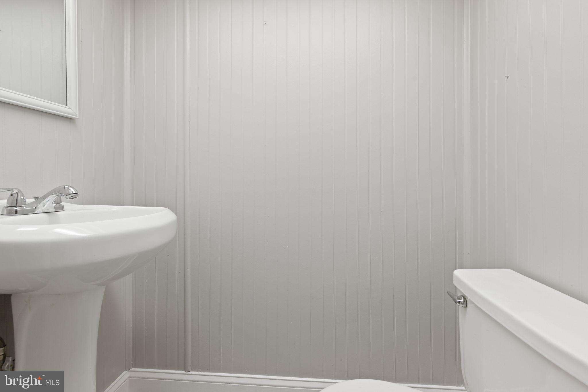 7731 Eastdale Road Baltimore, MD 21224 - Photo 19 of 26 a bathroom with a sink and a toilet