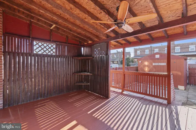 a view of a balcony with wooden floor