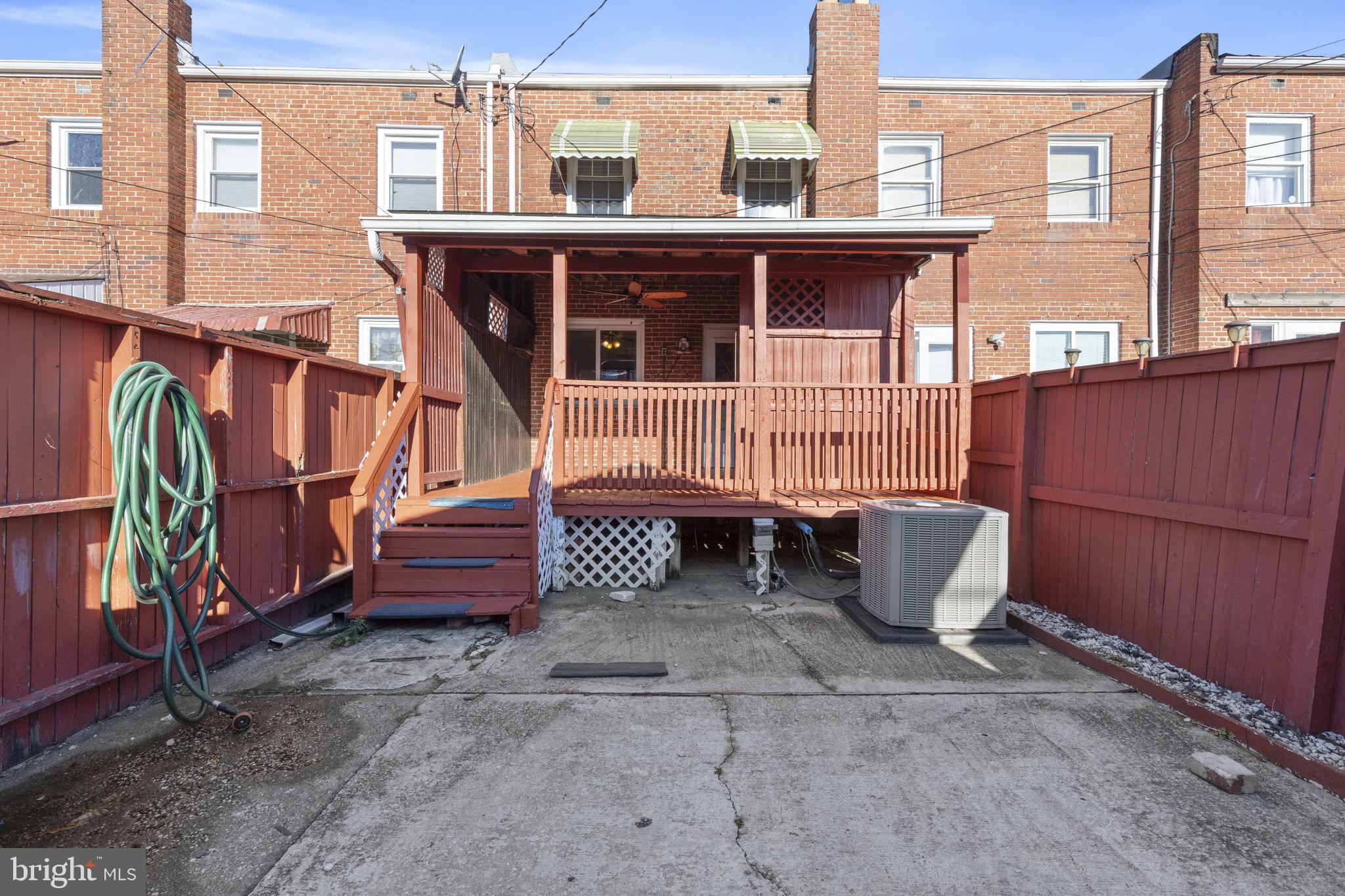 7731 Eastdale Road Baltimore, MD 21224 - Photo 22 of 26 a roof deck with a table and chairs